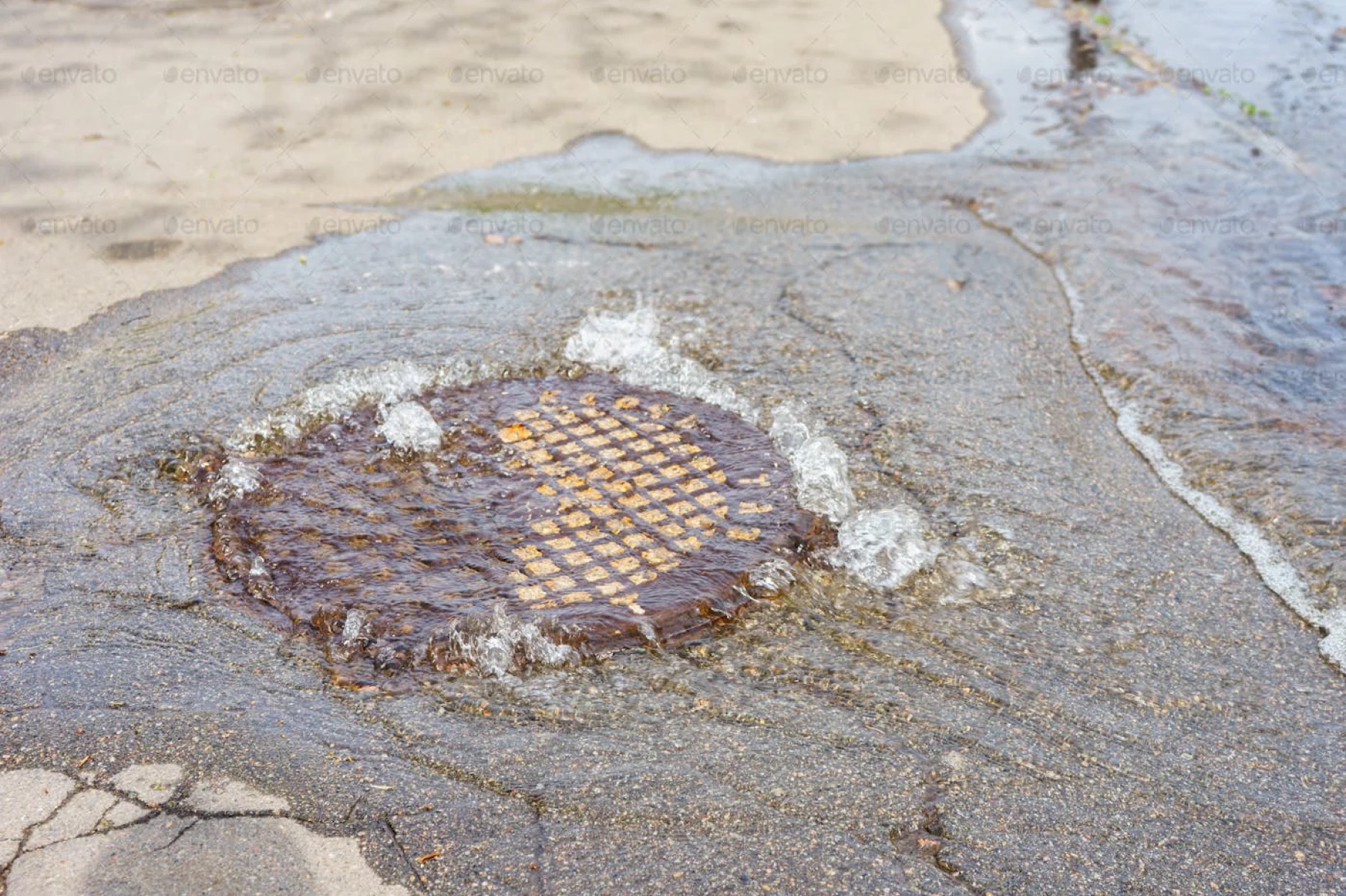 Water backing up through a catch basin grate